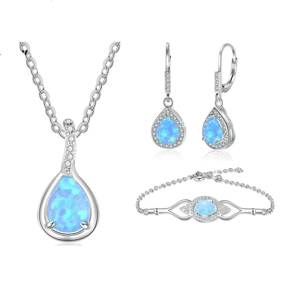 Descubra o Conjunto Opala Azul com Colar Gota Opala, Brincos Gota Opala e Pulseira Prata 925. Perfeito para ocasiões especiais como aniversário e casamento, este conjunto feminino combina estilo e durabilidade. Feito com Prata 925 e Opala, é ideal para mulheres que buscam elegância e qualidade em seus acessórios.