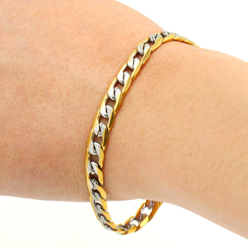 Descubra a Pulseira Masculina em Aço Inoxidável com Mix de Ouro e Prata. Estilo Punk e Hiphop para os amantes da moda. Com Fecho LOBSTER e Design Avançado, essa Pulseira de 22cm se destaca no mundo dos acessórios. Elegância e Durabilidade em um só produto. Ideal para quem busca versatilidade e luxo.